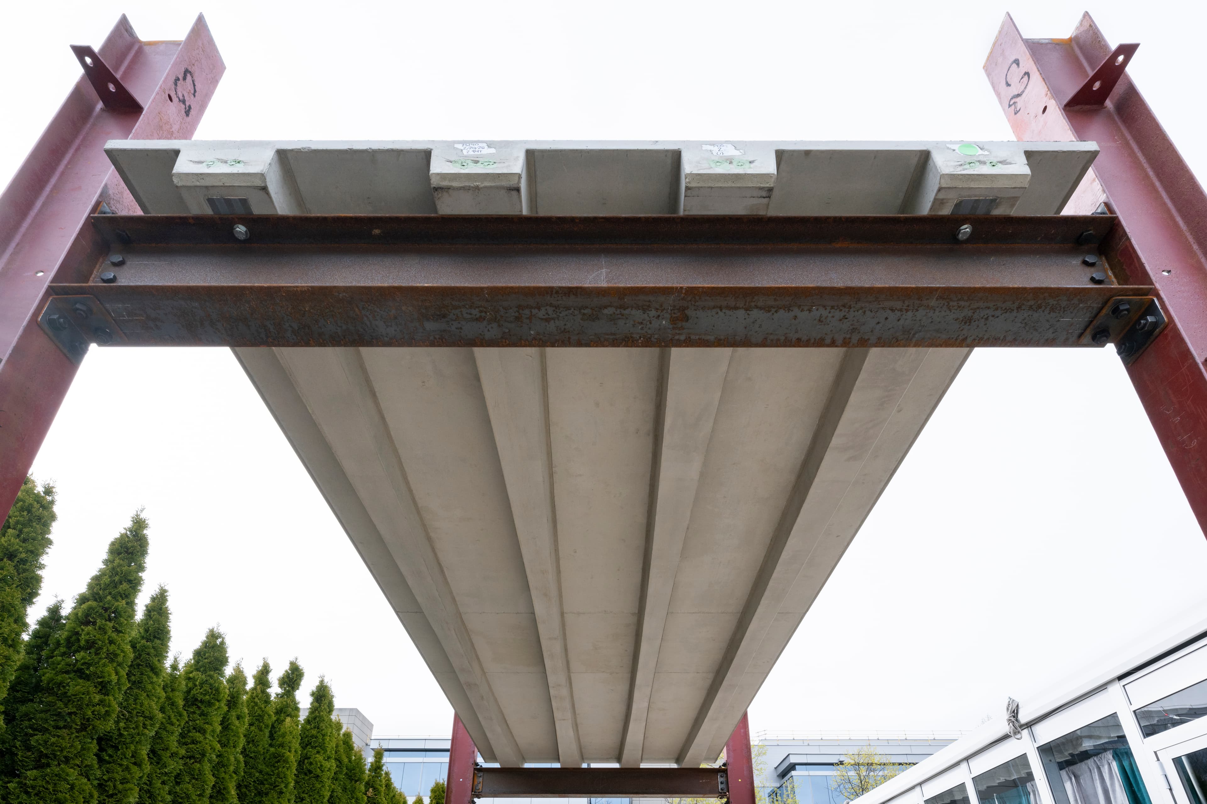 Installed shape-optimized precast slab — full-scale prototype designed by Cimbra and cast by J.P. Carrara & Sons